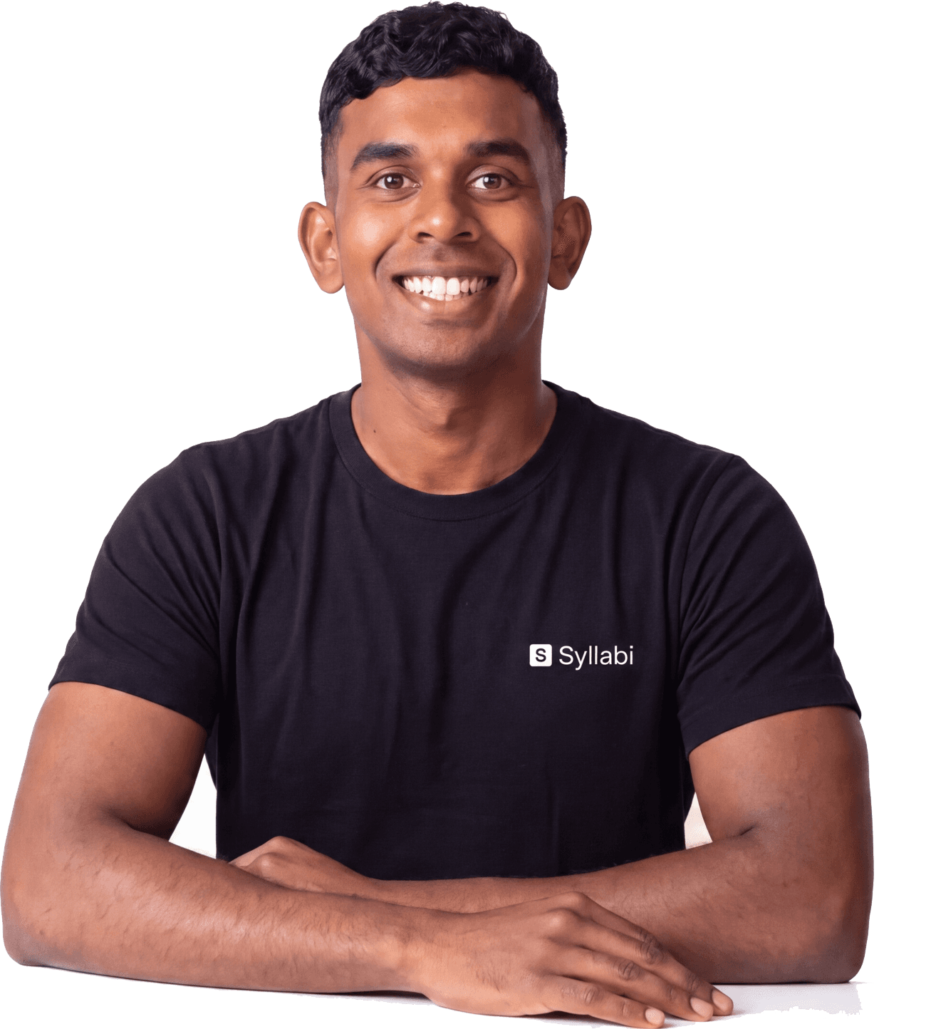 Nikhil, a Syllabi mentor, seated with his arms resting in front of him